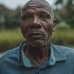Captivating portrait of a senior African man with a serious expression outdoors in Bujumbura.